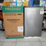 Hisense refrigerator beside its shipping box