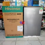 Hisense refrigerator next to branded cardboard box