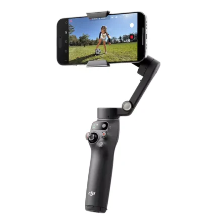 DJI smartphone gimbal filming child playing soccer outdoors