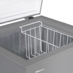 Open Hisense chest freezer with white wire storage basket